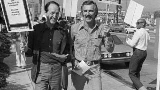 Two men on the picket line marching