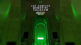 LA Memorial Coliseum peristyle entrance with green backlight.