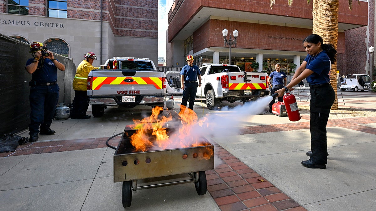 Great ShakeOut earthquake drill: Nina Patel puts out a fire