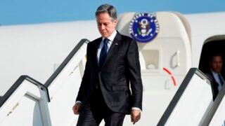 U.S. Secretary of State Antony Blinken disembarks from an aircraft