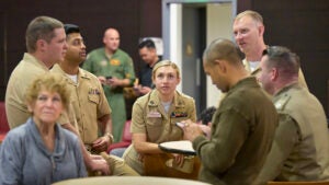 people dressed in military uniforms at event