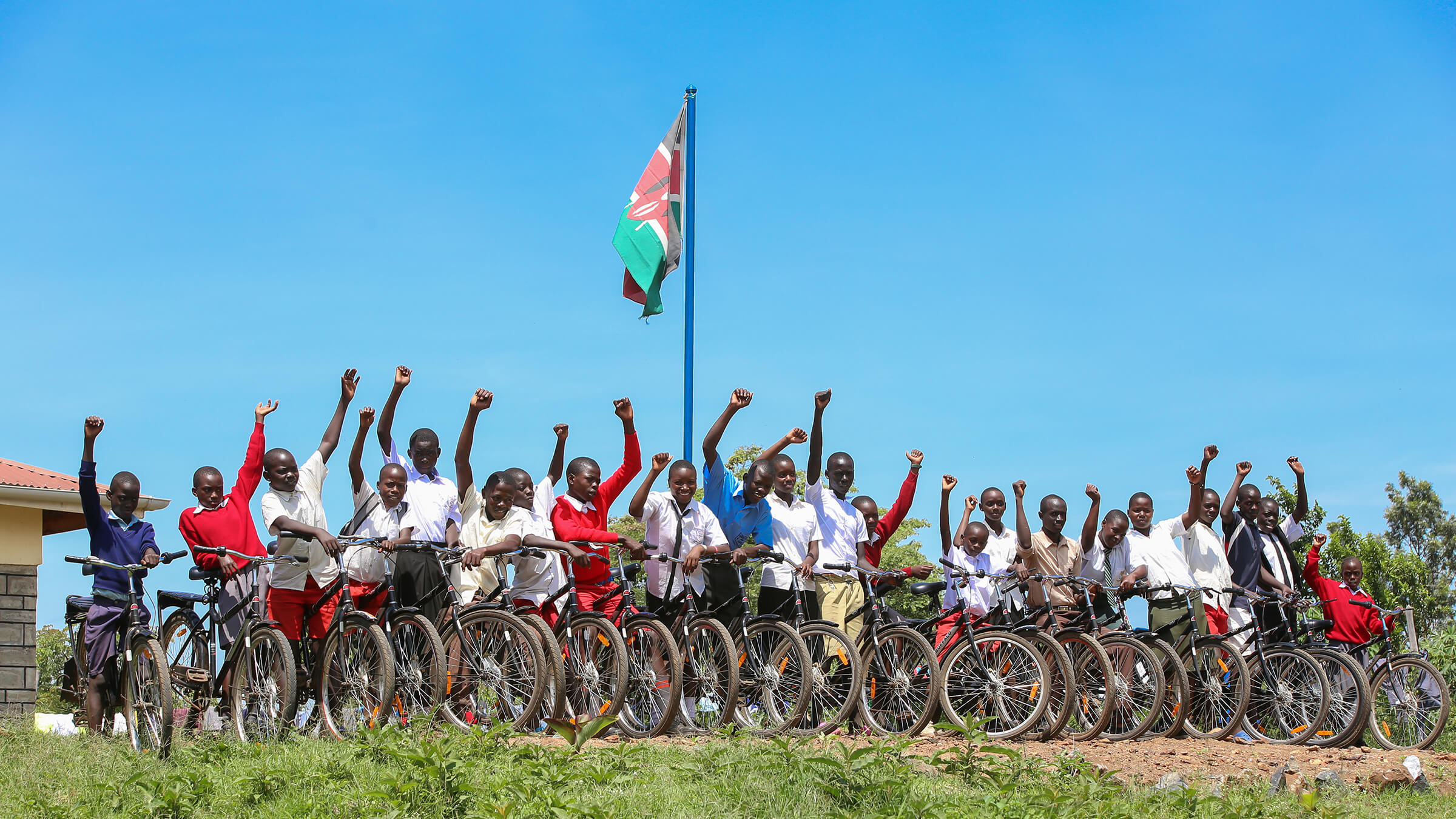Students in Kenya line up with their new bikes donated by One Bicycle.