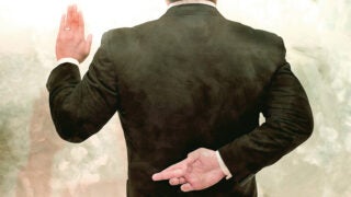 Person taking oath with crossed fingers behind his back