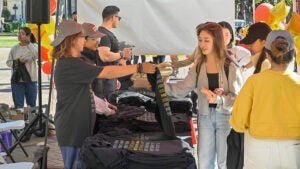 students wait in line for t-shirts