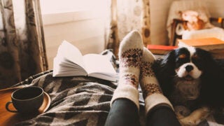 Person relaxing with their dog