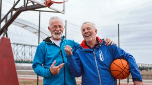 Alzheimer’s lifespan: Two older men on a basketball court