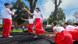 Troy Phi Philippines dance performing tinikling.