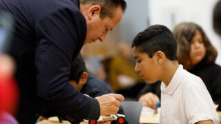 Brandon Ramirez of Hyundai Motor America helps student
