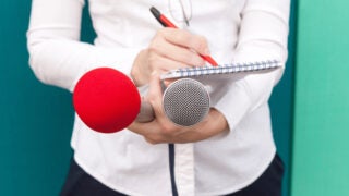 Reporter taking notes