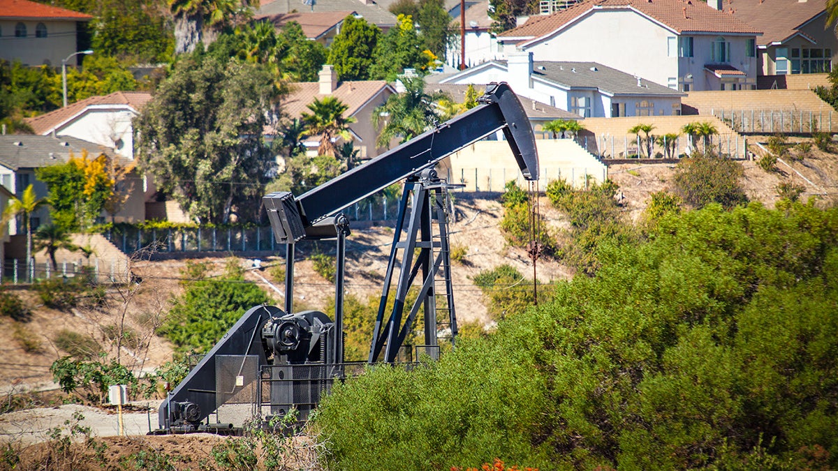 Oil pumpjack near homes in the Inglewood Oil Field.