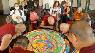 Sand mandala at USC Pacific Asia Museum: People watch monks work