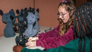 Amy O’Connell and Jennifer Ayissi customize Blossom the Robot