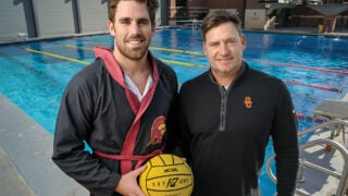 Max Miller and Dr. Seth Gamradt director of orthopedic medicine for USC athletics, right, at the USC aquatics center