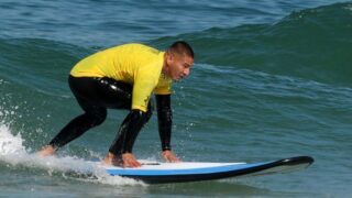 A man surfing in the ocean