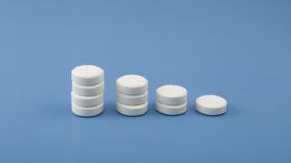 Illustration: Medicine tablets in stacks