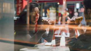 Woman and man eating fast food