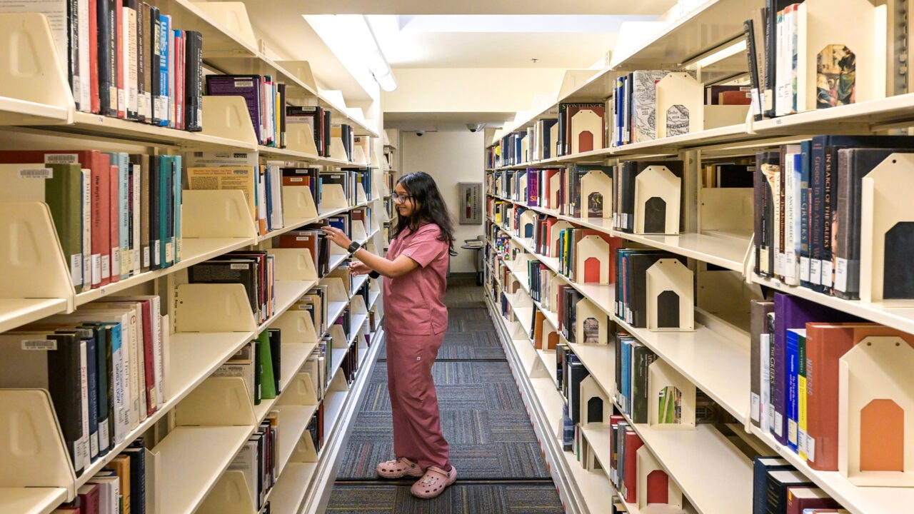 While staff help students access digital materials and master the latest tech tools, the library maintains a core collection of texts in the arts, humanities and sciences. (USC Photo/Gus Ruelas)