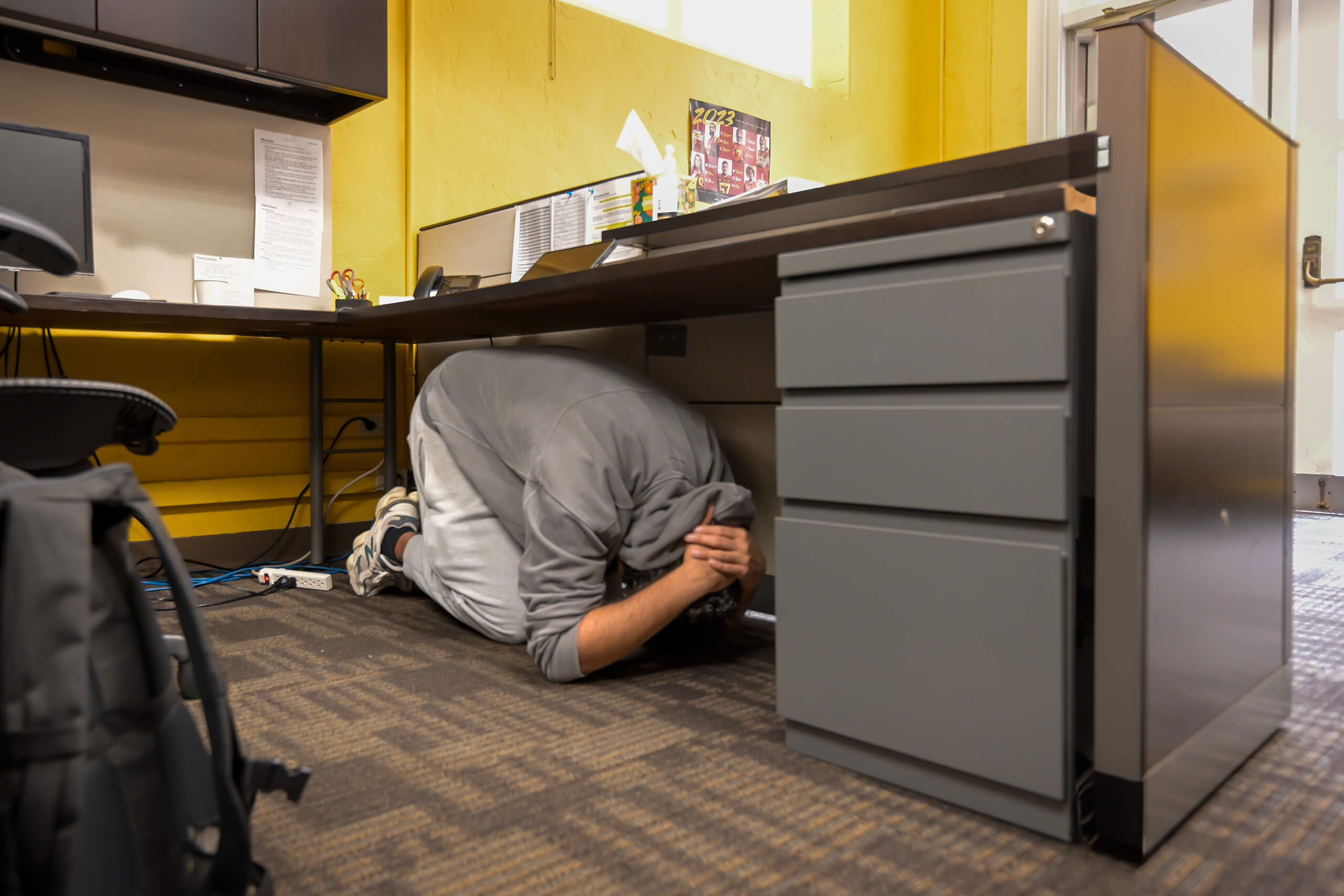 Great ShakeOut: Student Hamzah Ahmad takes cover