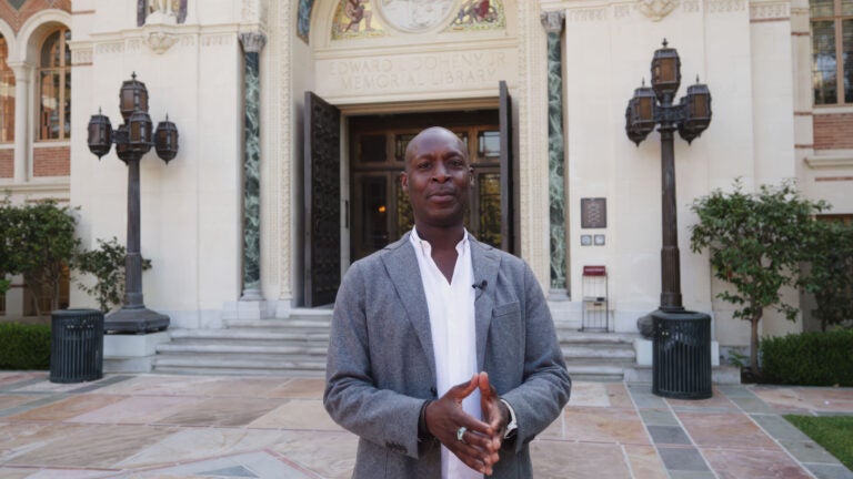 Man standing in front of a building