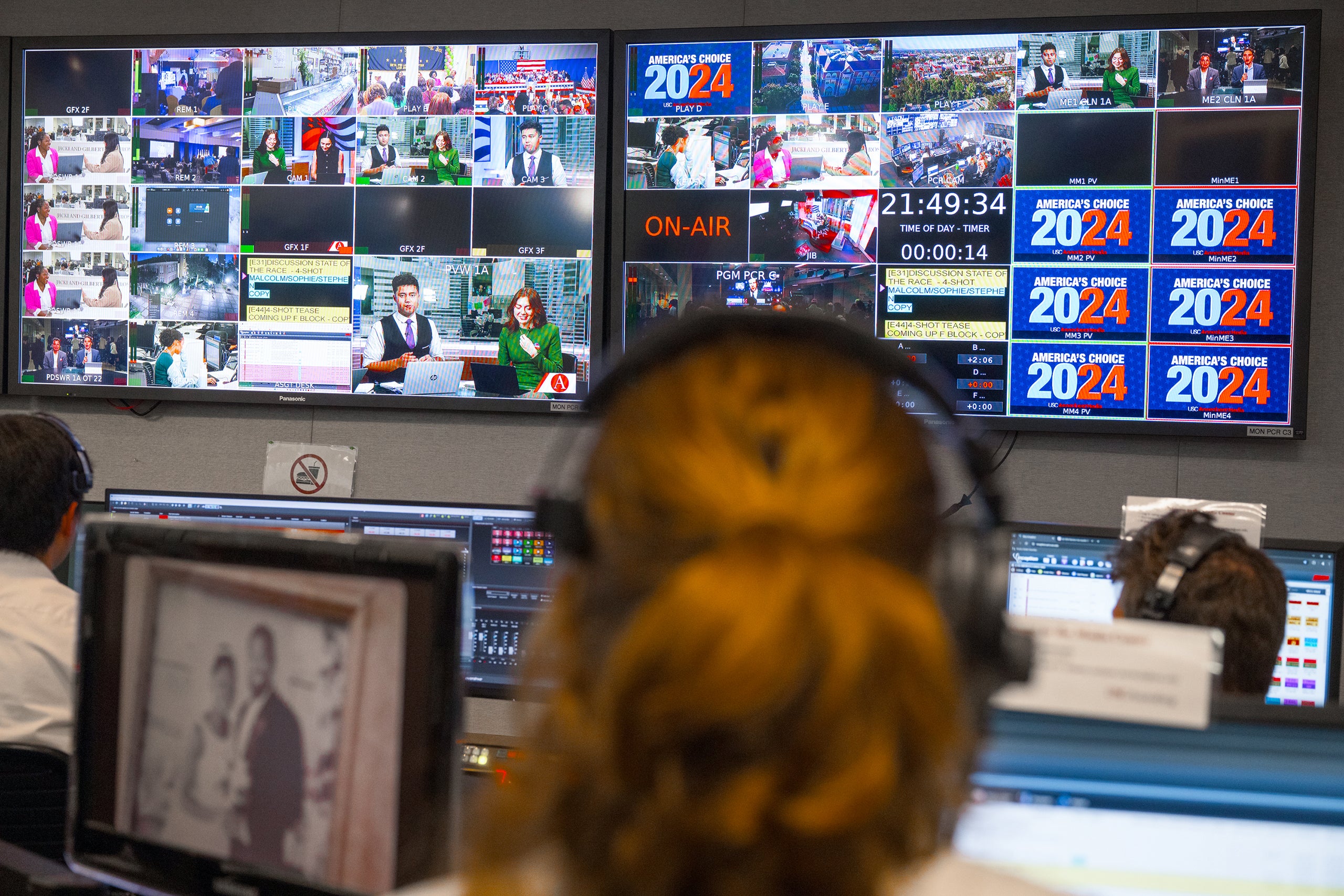 A control room with multiple monitors displaying various camera feeds and graphics for 'America's Choice 2024.' 