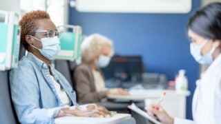 Patient wearing a mask with clinician