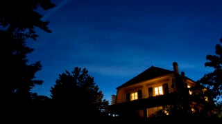 Home with a night sky behind it