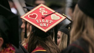 Commencement: Person with Fight On! on their cap