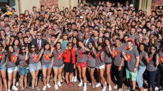 President Carol Folt takes a group shot with McCarthy Honors Residential College students during move-in day in 2019.(Photo/Gus Ruelas)
