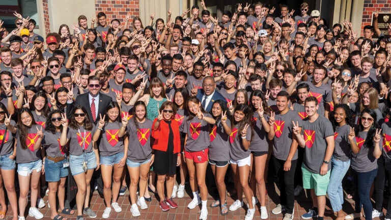 President Carol Folt takes a group shot with McCarthy Honors Residential College students during move-in day in 2019.(Photo/Gus Ruelas)
