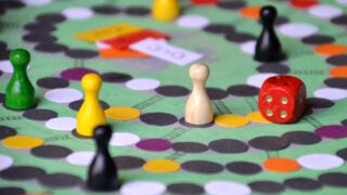 Game pieces and a die