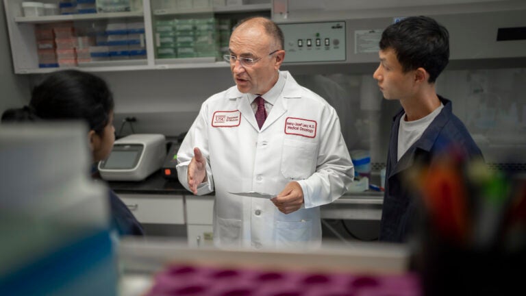 Heinz-Josef Lenz with Pooja Mittal and Jae Ho Lo