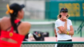 Barbara Hallquist DeGroot watching a tennis match