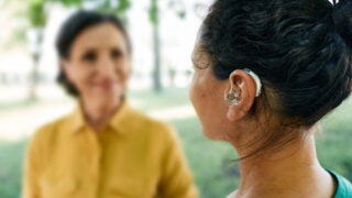 Woman wearing hearing device
