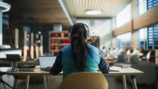 Female student working in library
