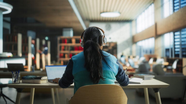 Female student working in library