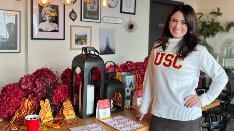 Michelle Escobar ’02 stands tall with cardinal and gold in Seattle.