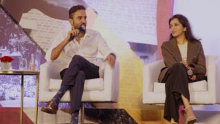 Ajai Thandi ’13 (left) speaks in a panel that includes lawyer Niyati Shah ’22 (right) at the USC India Innovation Summit in 2024. (Photo/Little Conversations)